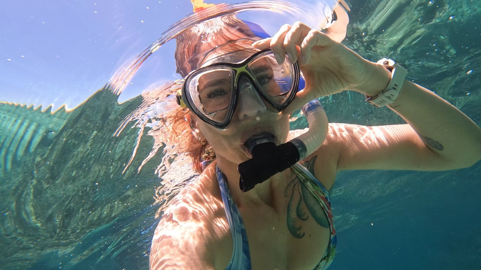 Guests snorkeling over a coral reef in San Blas
